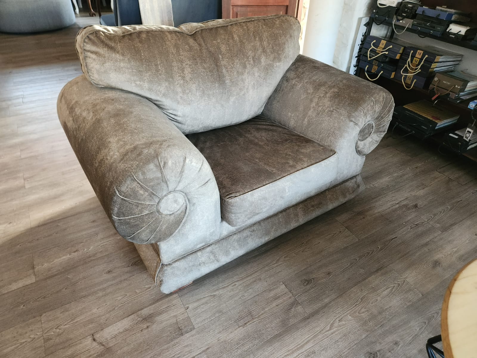Champagne velvet chesterfield armchair in the workshop showroom